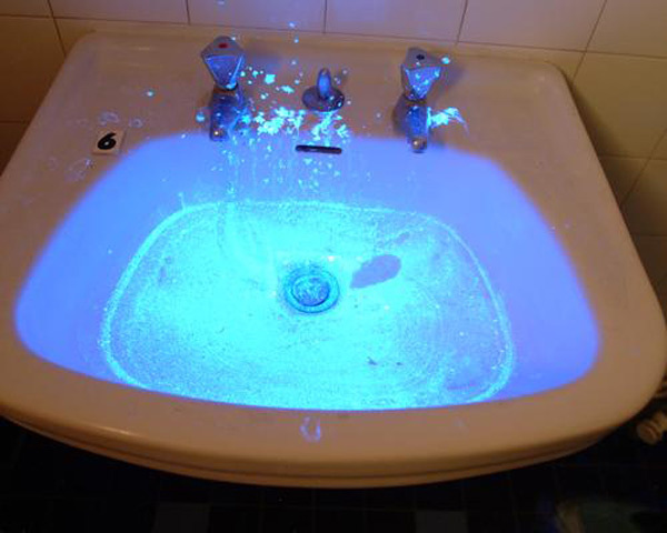 luminol glowing in a sink